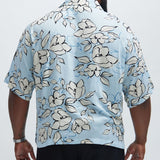 Camisa de botones con temática floral - Azul claro