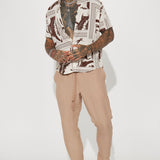 Pantalones con cintura elástica texturizada y rajas laterales - marrón.