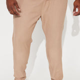 Pantalones con cintura elástica texturizada y rajas laterales - marrón.