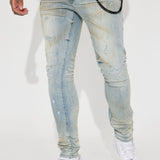 Acerca de mis jeans ajustados rasgados apilados con lavado en tono azul vintage