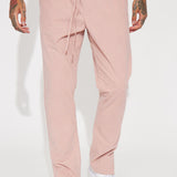 Pantalones slim con textura y abertura en la parte inferior - Malva