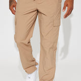 Pantalones de carga de nylon aguas arriba - color topo.