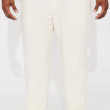 Pantalones de lino sólido con textura de cintura elástica y abertura lateral - Crema