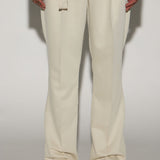 Pantalones de tela plisada de lujo Thomas - Blanco desgastado con aberturas en la parte inferior.
