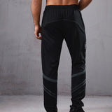 Manfinity Fitness Pantalones deportivos con estampado de letra