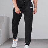 Manfinity Fitness Hombres Pantalones deportivos con estampado de letra con cordon