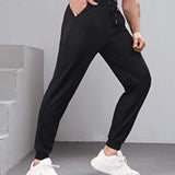 Manfinity Fitness Hombres Pantalones deportivos con estampado de letra con cordon