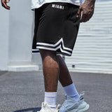 Manfinity Homme Hombres Shorts con estampado de letra ribete de rayas