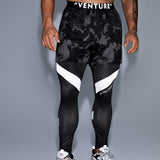 Manfinity Fitness Hombres Pantalones deportivos con estampado de slogan reflectante 2 en 1 con bolsillo para telefono