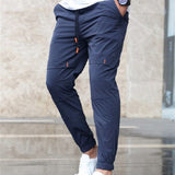 Manfinity Homme Pantalones largos para hombres con cintura ajustable con cordon en color azul marino liso para salir