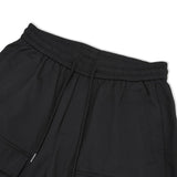 Manfinity EMRG Hombres Pantalones sueltos de carga con bolsillo de solapa, detalle de hebilla, cintura con cordon y largo largo, color negro liso, ideal para salir o musicos de rap