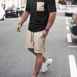 Manfinity Homme Conjunto de camiseta con estampado de eslogan y pantalon corto con cordon en la cintura para hombre