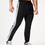 Manfinity Fitness Hombres Pantalones deportivos con estampado de corona y letra con costura lateral en contraste de cintura con cordon