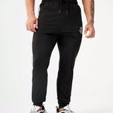 Manfinity Fitness Hombres Pantalones deportivos con estampado de corona y letra con costura lateral en contraste de cintura con cordon