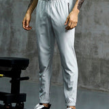 Manfinity Sport Corelite Hombres Pantalones deportivos con bolsillo con cremallera de cintura con cordon