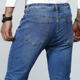 Manfinity Homme Jeans ajustados lavados largos para hombre, de color azul plano y estilo basico de trabajo de carga, esposo