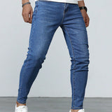 Manfinity Homme Jeans ajustados lavados largos para hombre, de color azul plano y estilo basico de trabajo de carga, esposo