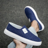 Zapatos deportivos informales de lona azul para hombre con estilo simple, comodos y transpirables con patron de payaso.