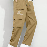 Manfinity Pantalones Cargo Graficos De Eslogan Y Corte Holgado Para Hombre Con Bolsillos Con Solapa Y Cintura Con Cordon Lateral