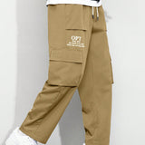 Manfinity Pantalones Cargo Graficos De Eslogan Y Corte Holgado Para Hombre Con Bolsillos Con Solapa Y Cintura Con Cordon Lateral