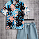 Manfinity Chillmode Conjunto De Camisa De Manga Corta Con Estampado Tropical Y Pantalones Cortos De Color Liso Para Hombre