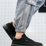 Zapatos de lona transpirables para hombres de moda, diseno simple, unicolor, tacon plano, zapatos casuales negros comodos para exteriores