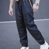 Joggers con cintura ajustable y tiro de bloque de color y parche de cuadros para hombre