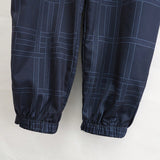 Joggers con cintura ajustable y tiro de bloque de color y parche de cuadros para hombre