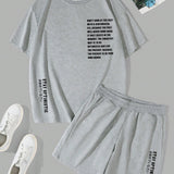 Manfinity Homme Conjunto holgado para hombres con camiseta grafica con eslogan y pantalones cortos de cintura con cordon