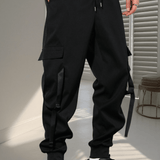Pantalones deportivos informales de carga de los hombres en color negro con multiples bolsillos y punos con cordon