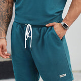 Manfinity Conjunto de camiseta de manga corta y pantalones cortos de 2 en 1 para hombres de talla grande, color block casual de verano E2