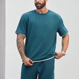 Manfinity Conjunto de camiseta de manga corta y pantalones cortos de 2 en 1 para hombres de talla grande, color block casual de verano E2