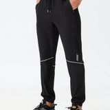 Manfinity Running Pantalones de chandal para hombre con estampado geometrico, cintura con cordon y bolsillos