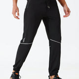 Manfinity Running Pantalones de chandal para hombre con estampado geometrico, cintura con cordon y bolsillos