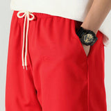 Pantalones deportivos casuales rojos para hombre con bolsillos laterales de carga rectos