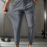 Pantalones deportivos casuales elasticos para correr al aire libre de primavera/verano para hombre con cordon en la cintura, cremallera y bolsillos en unicolor