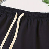 Conjunto de verano para hombres con camiseta casual de manga corta y cuello redondo con letras impresas y shorts con cordon en la cintura