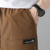Pantalones cargo rectos y amplios para exteriores casuales para hombre con bolsillos multiples holgados, color marron