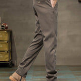 Pantalones de hombre casuales ajustados con cintura elastica y bolsillos inclinados