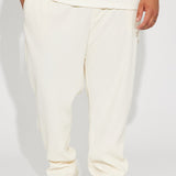 Mostrar pantalones estrechos con aberturas en color blanco apagado