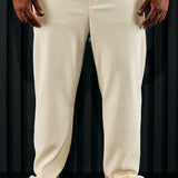 Mostrar pantalones estrechos con aberturas en color blanco apagado
