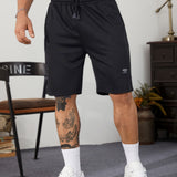 Manfinity Homme Hombres Shorts deportivos con estampado de letra con cordon